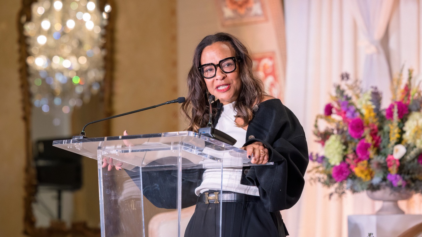 Monica Dean delivering closing remarks at the summit.