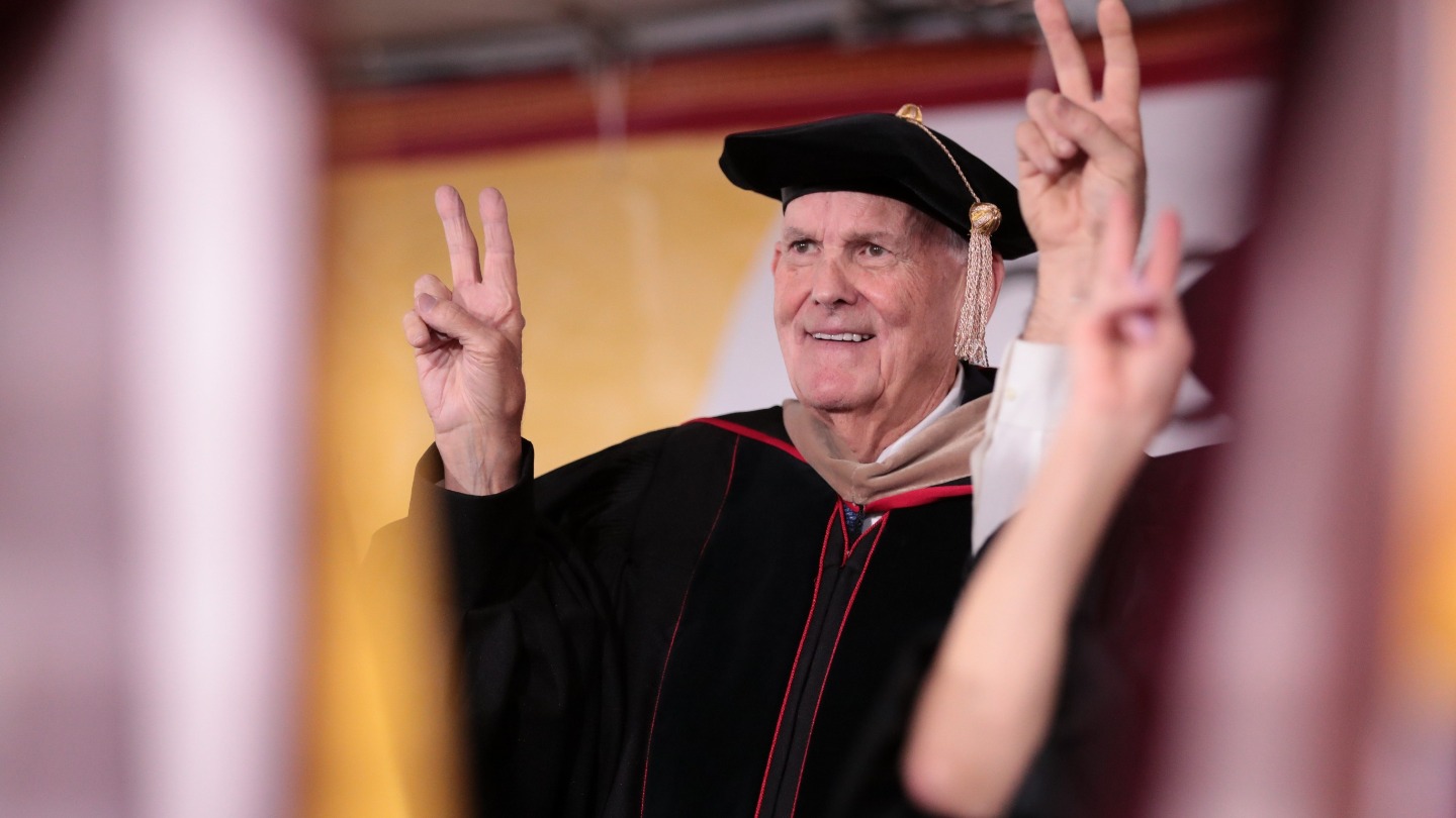 Dean William Holder with the Fight On sign