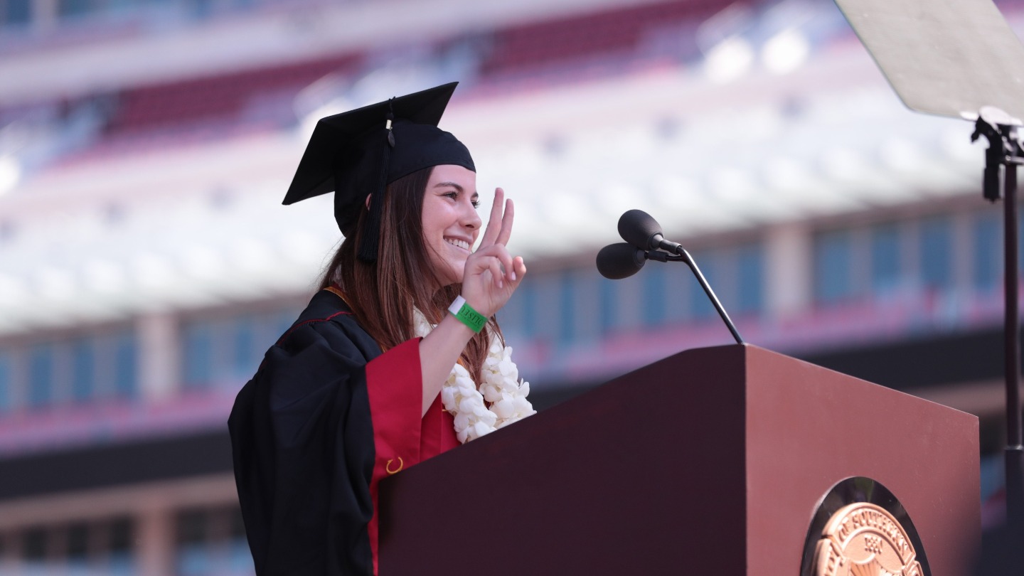 Jamie Morgan giving the Fight On! symbol.