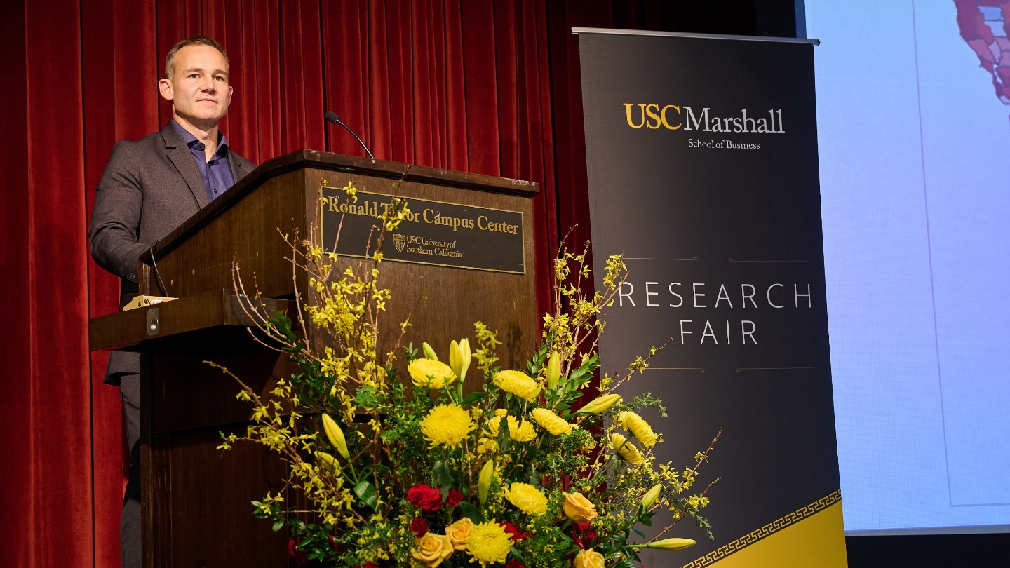Shane Heitzman speaks at a podium.