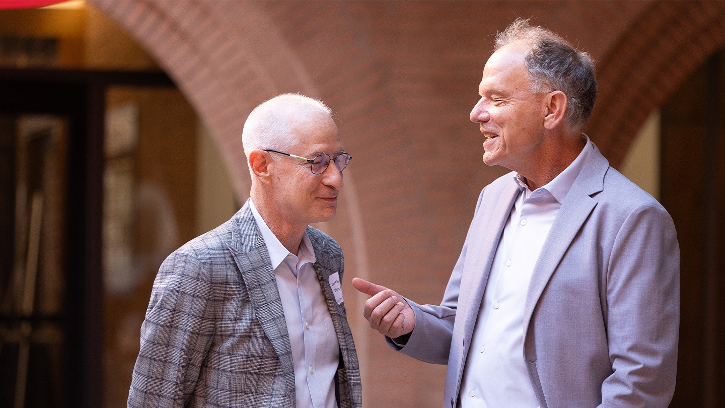 Color photograph of Dean Pinchas Cohen and Dean Geoffrey Garrett at the Aging is Now / Aging is the Future: Entrepreneurship Symposium.
