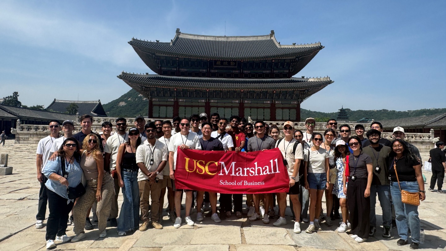 students standing in front of a Gyeongbok Palace