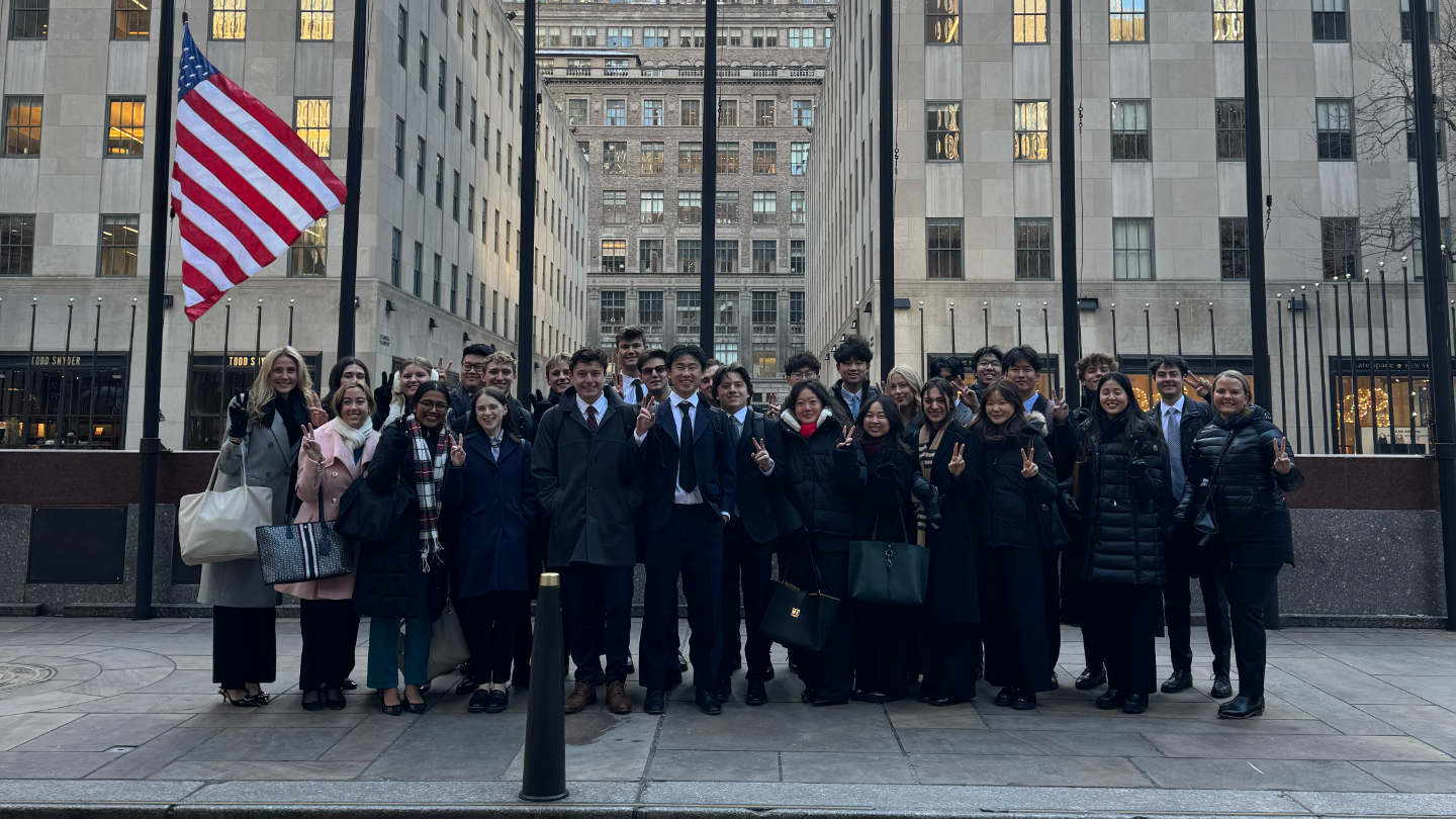 Students standing in front of a building