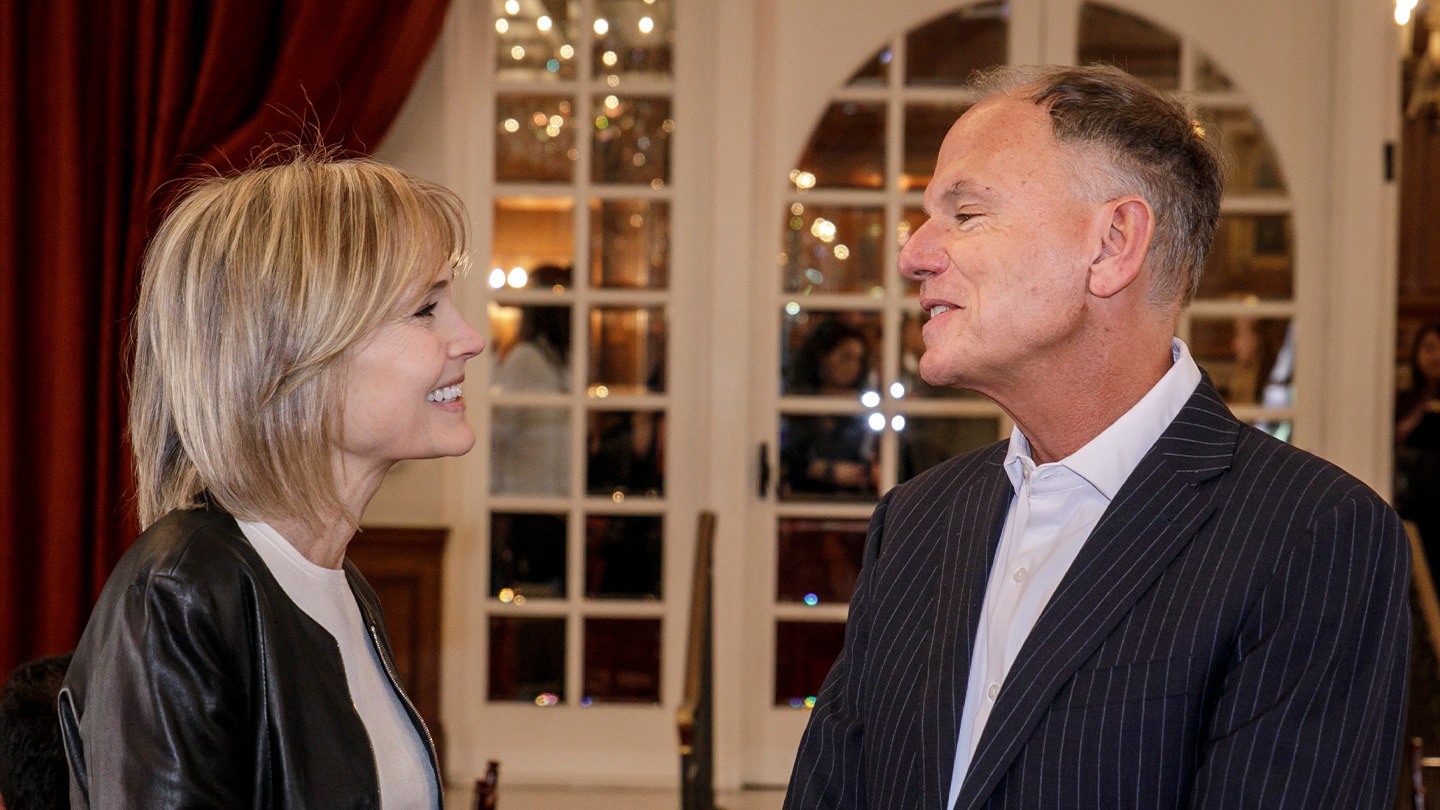 Annenberg School for Communication and Journalism Dean Willow Bay speaks with Marshall School of Business Dean Geoff Garrett at ATHENA. The two schools co-host the annual event.