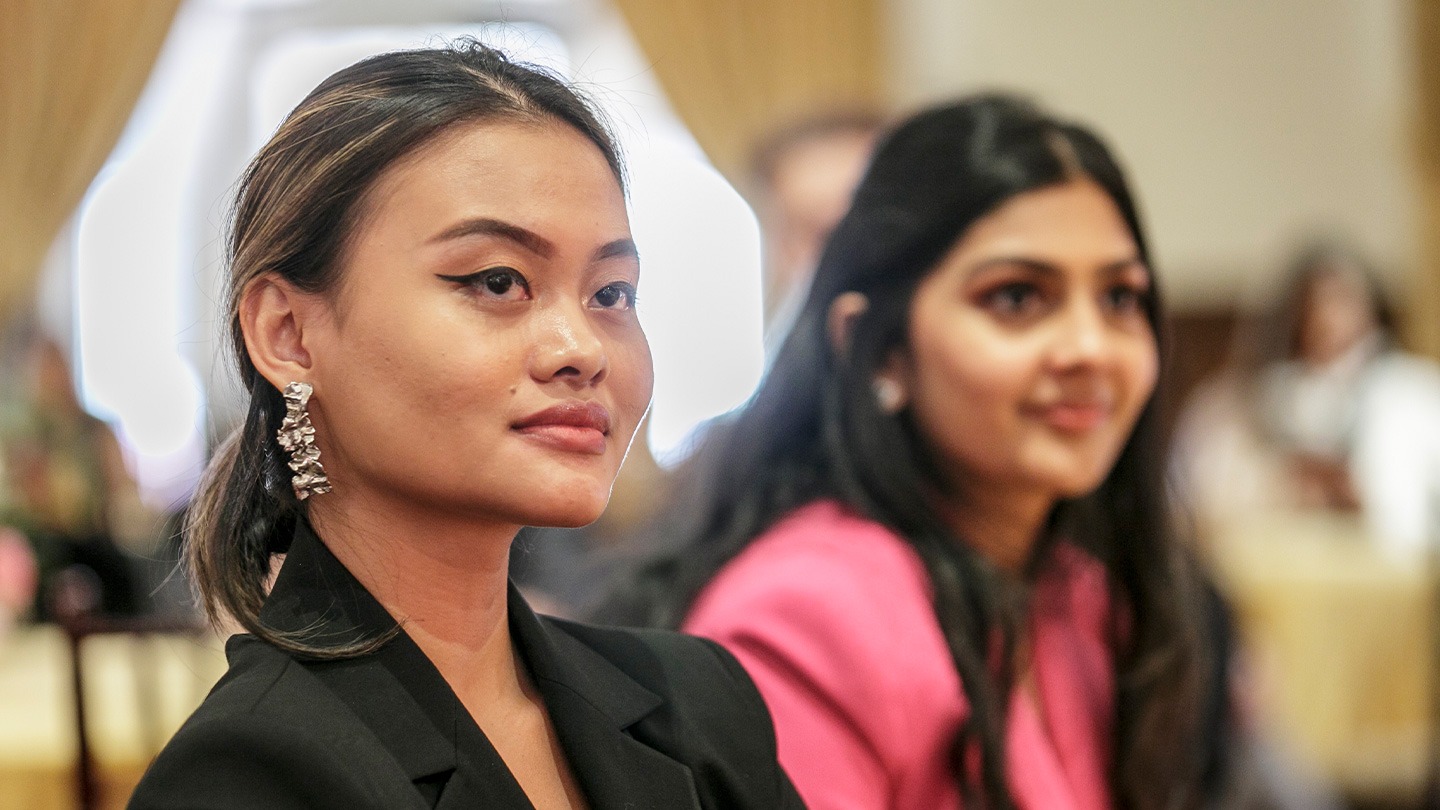 Student entrepreneurs Nidyanthy Pratiwi and Saloni Nahar watch proceedings.