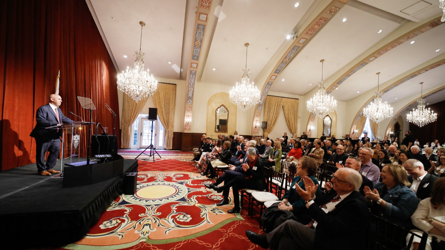 Andy Call address an invited audience.