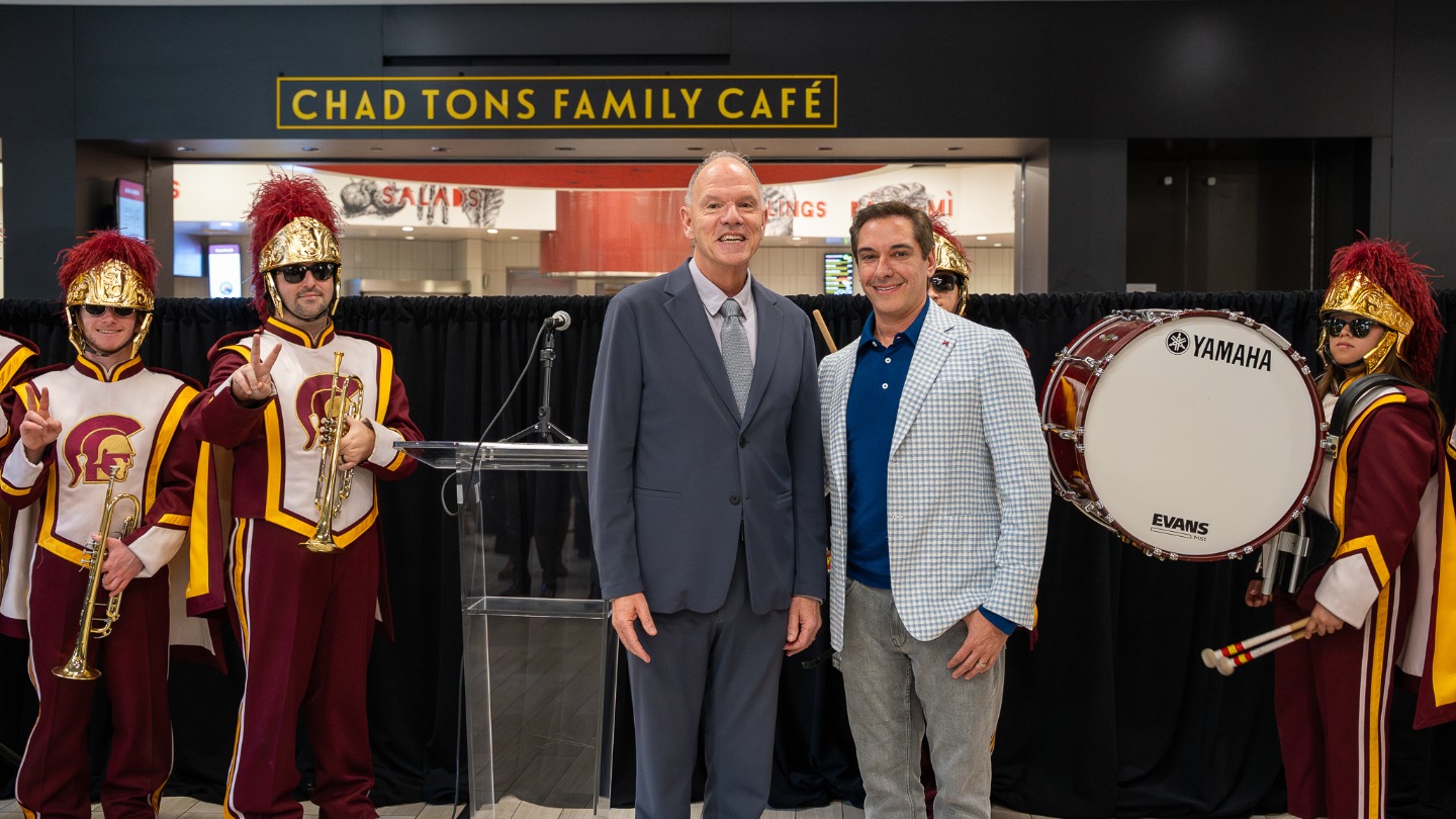Chad Tons and Dean Geoffrey Garrett in front of the Chad Tons Family Cafe