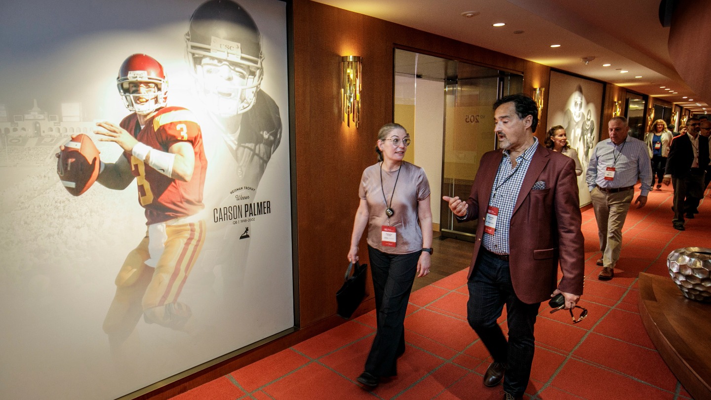 Deans walk through the halls of the Coliseum.