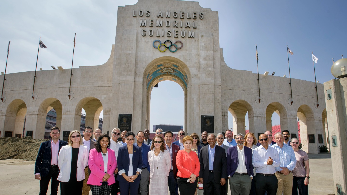 California deans stand in front of the LA Memorial Colisum.