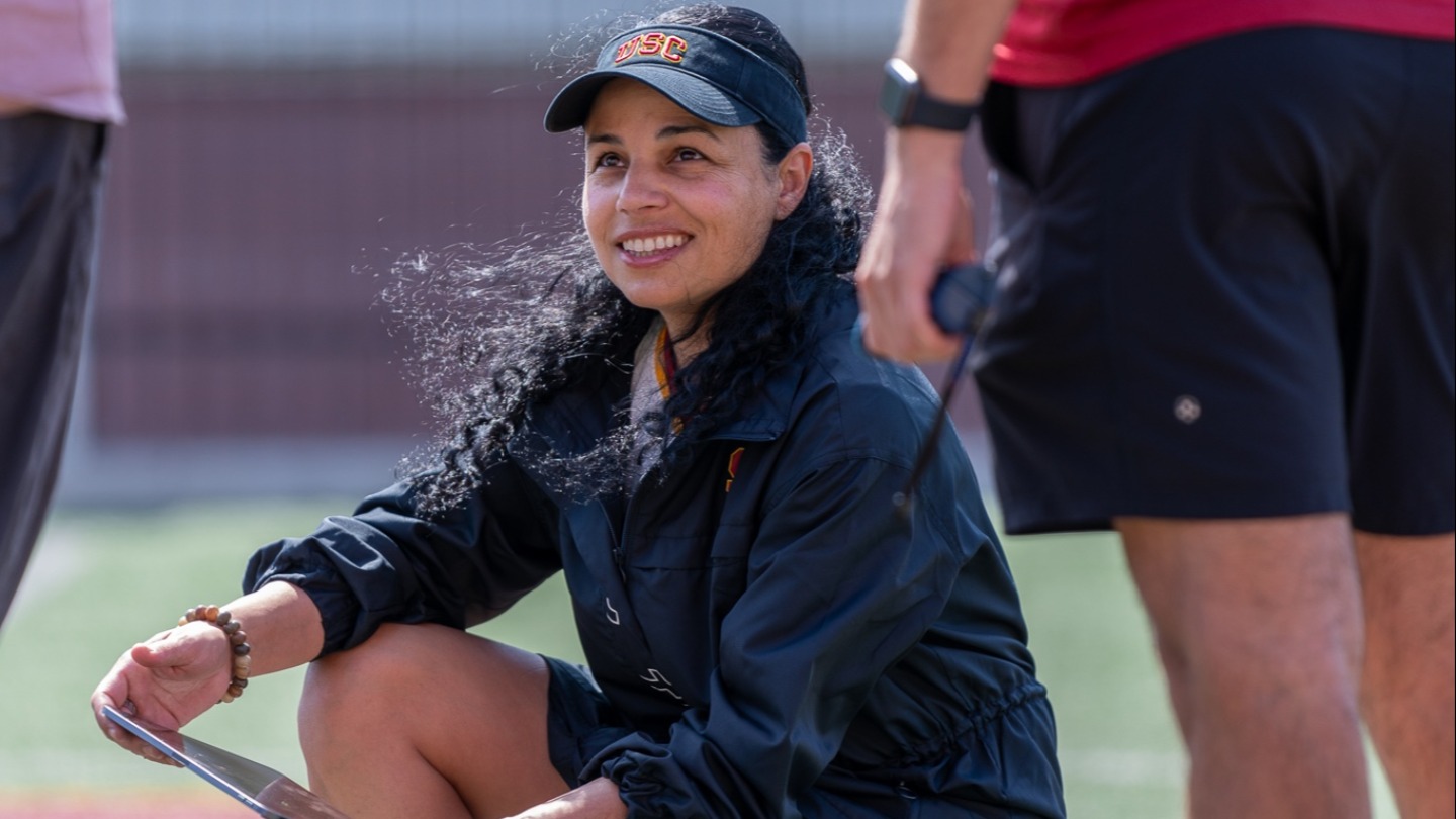 Professor Lorena Martin takes her students to the field to learn how to collect data.