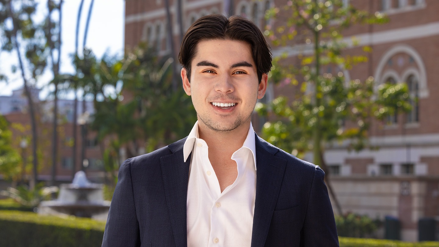 Color photograph of Enzo Coglitore '23 on the USC campus.