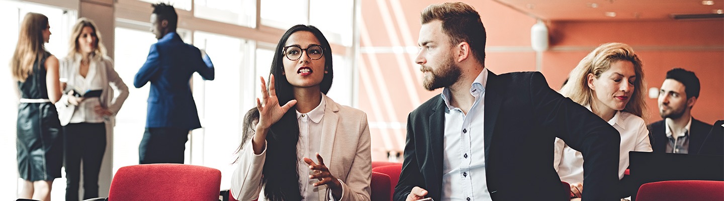 Two executive MBA students talking.