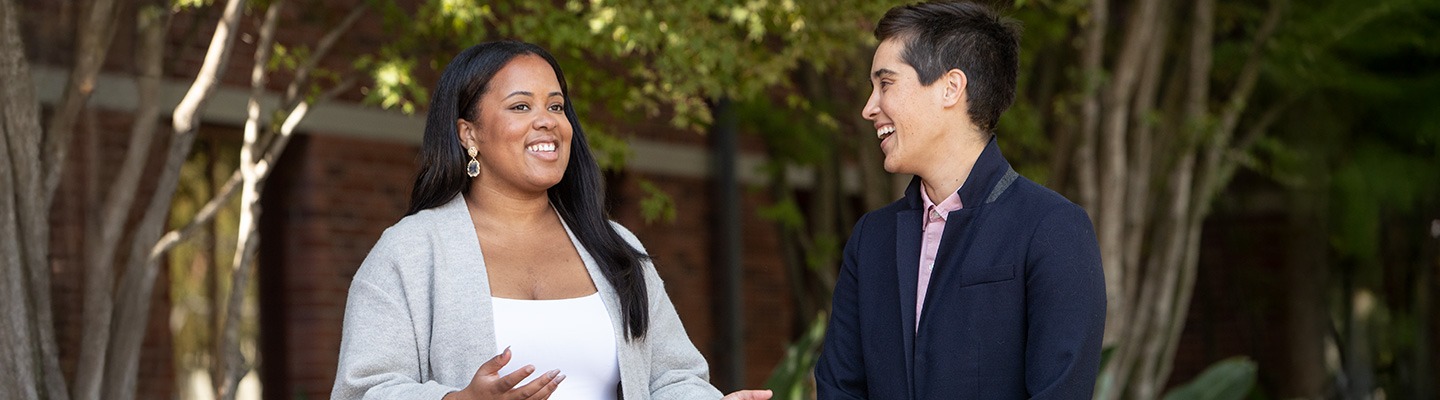 Two graduate students chatting on the USC campus.