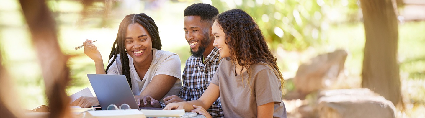Three students collaborating on a project.