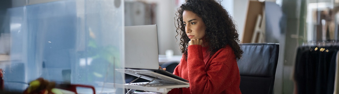 Woman studying on a laptop.