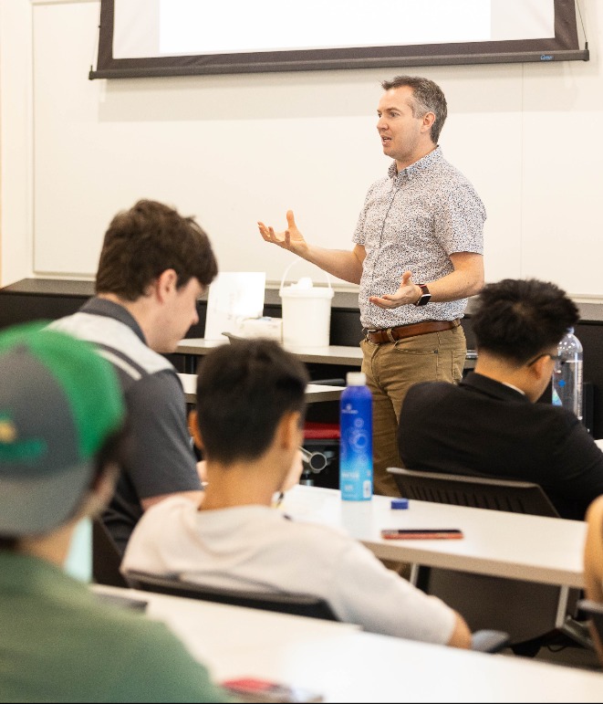 Faculty teaching in front of class