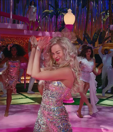 Margot Robbie dances center-frame in 'Barbie.'