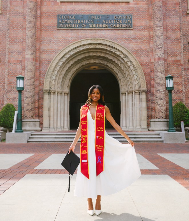 Jackson Dowell posing in her graduation sash