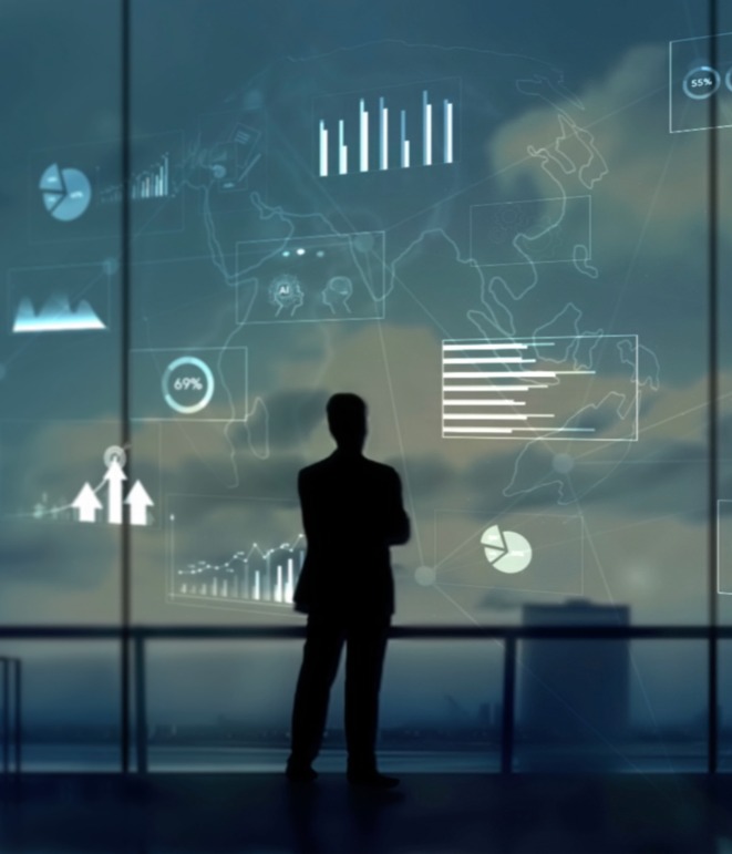 decorative image of businessman staring at graphs by a window