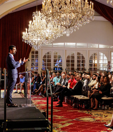 Raman Randhawa speaks to a crowd during Trojan Family Weekend.