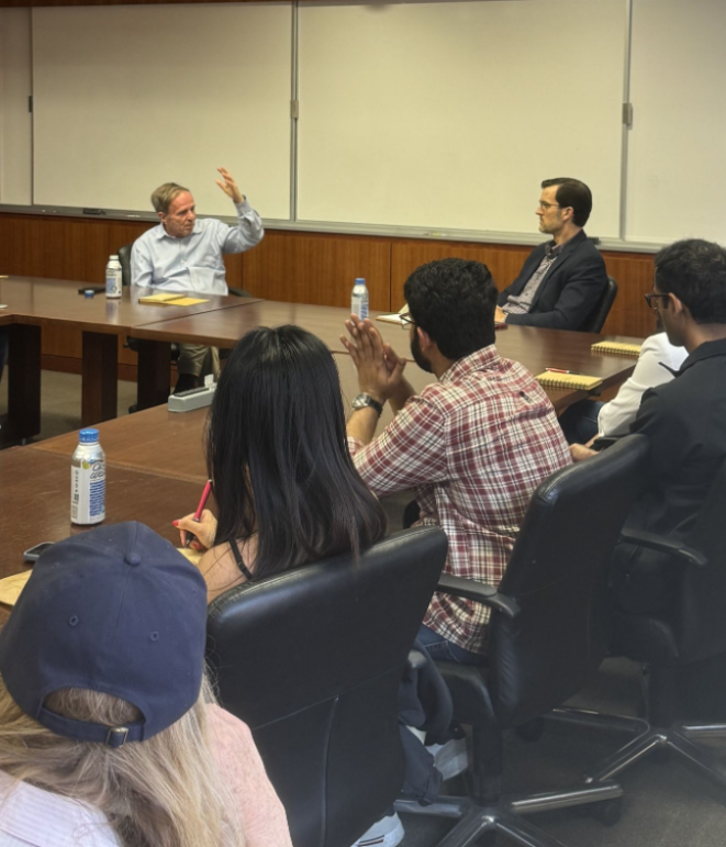 professor speaking to class sitting down