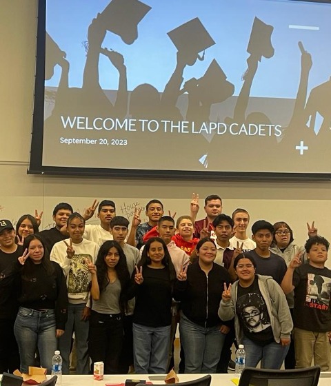 The LAPD Cadets give the &quot;fight on&quot; sign at the Real World Ready Workshop