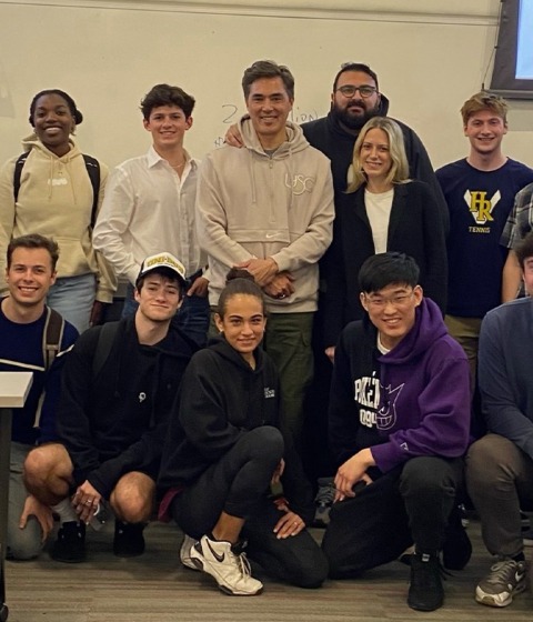 Color photograph of a group of students in a classroom at a USC Marshall course.