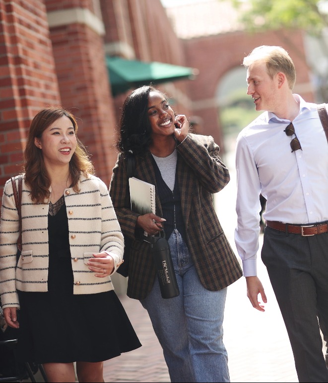 three Marshall students walking through campus