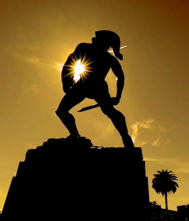 Color photograph of USC Marshall student on campus during the day.