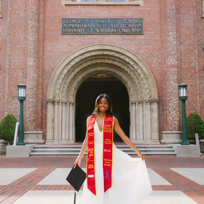 Jackson Dowell posing in her graduation sash