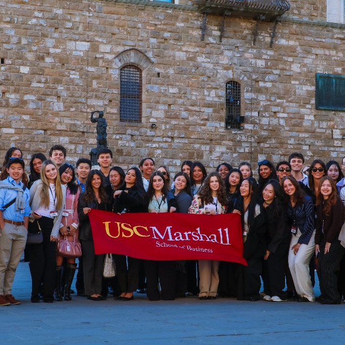 students holding up the Marshall banner in ITaly