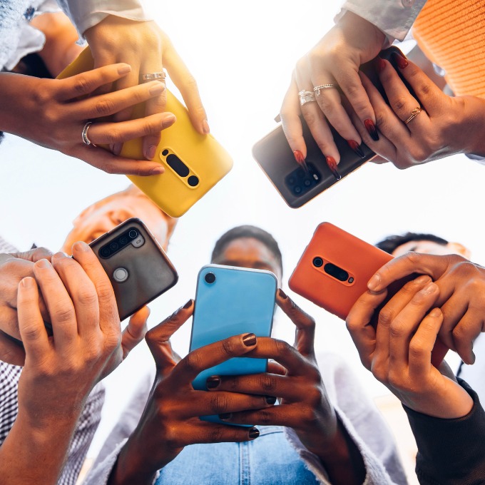 Students using phones in a circle