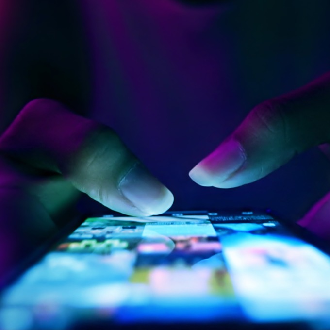 fingers typing on phone