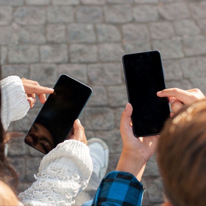 teenagers using their phones