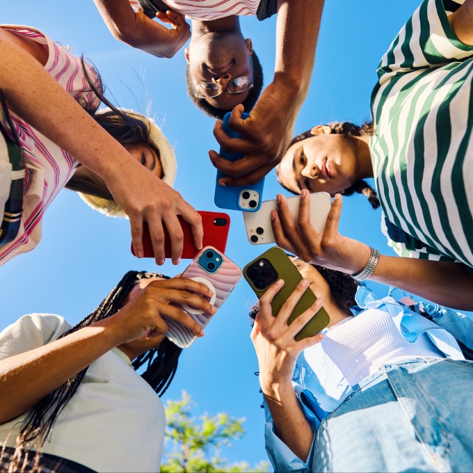 teens on their phone in a circle