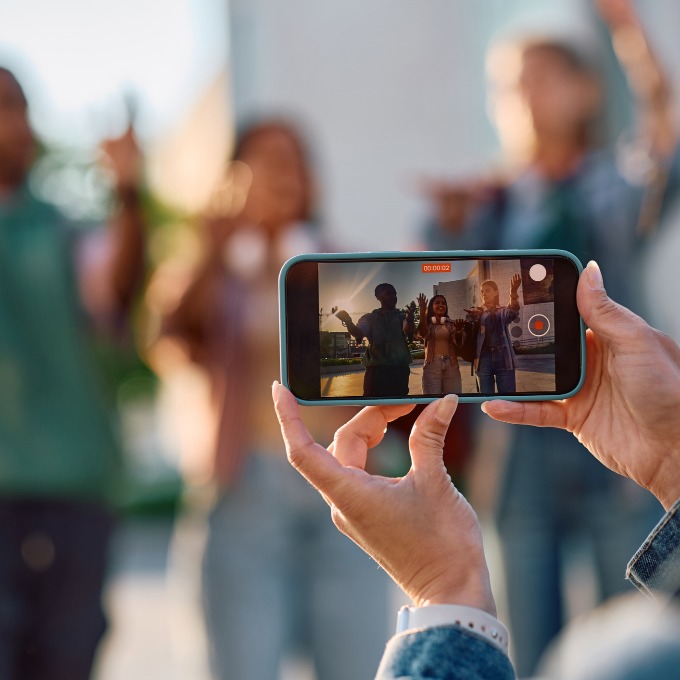 someone taking a photo with an iphone