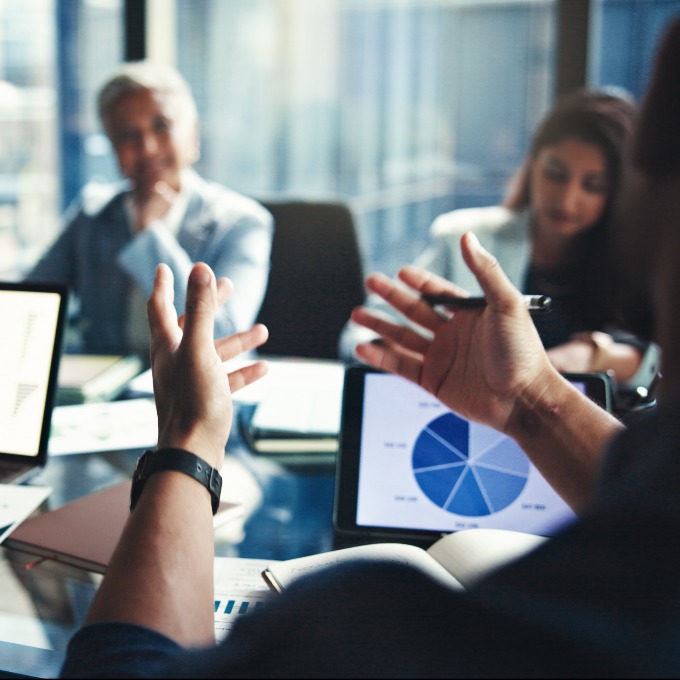 image of person gesturing at meeting