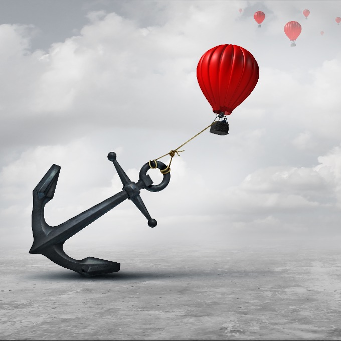 Held back metaphor as a large anchor holding or oppressing an air balloon and restricting movement as a suppression business metaphor from aspiring to succeed with 3D illustration elements.