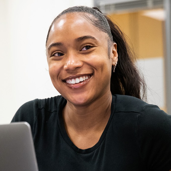 A graduate student at USC in a classroom.