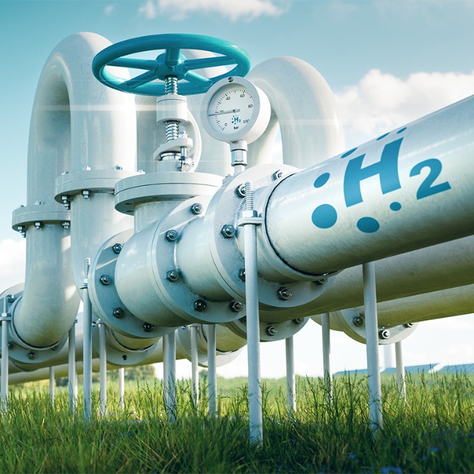 Color photograph of a pipeline on a sunny day.