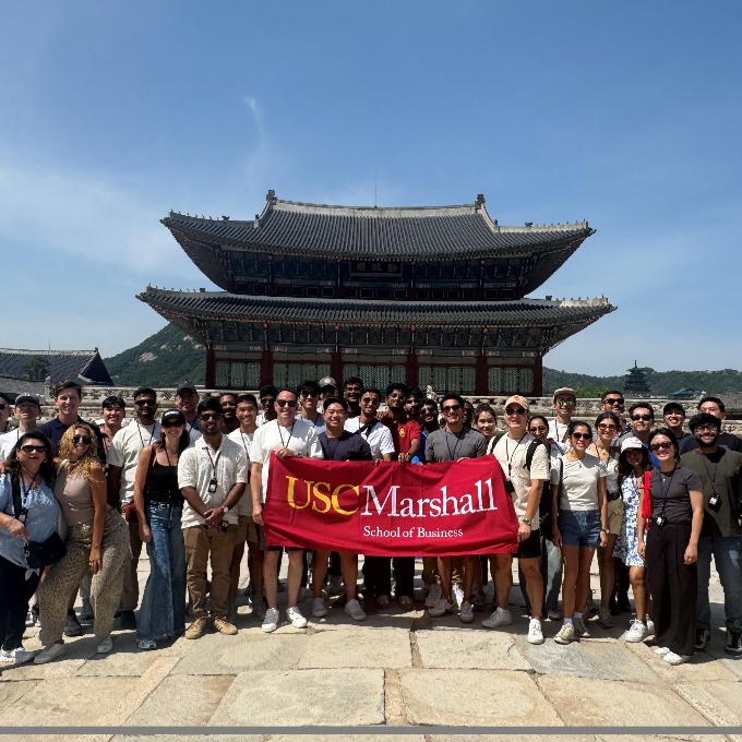 students standing in front of a Gyeongbok Palace