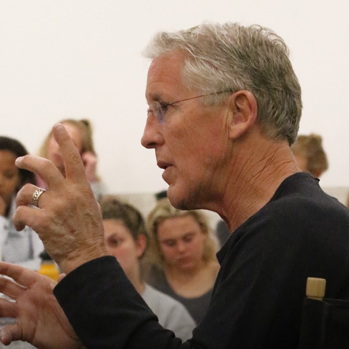 Pete Carroll speaking to a class.