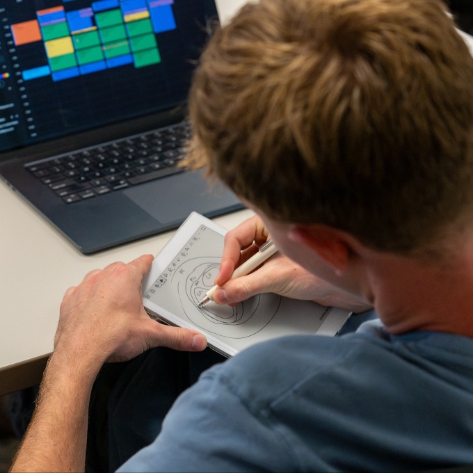 a BUAI student drawing AI models