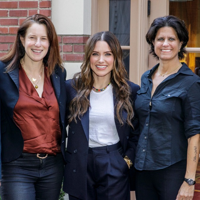 Kara Nortman, Sophia Bush, and Julie Uhrman pose in front of Town and Gown.