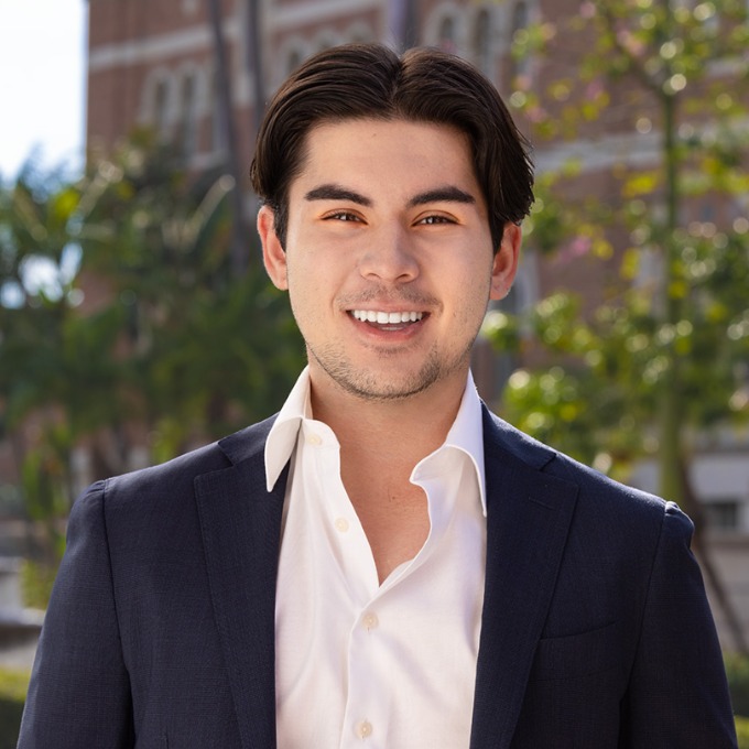 Color photograph of Enzo Coglitore '23 on the USC campus.