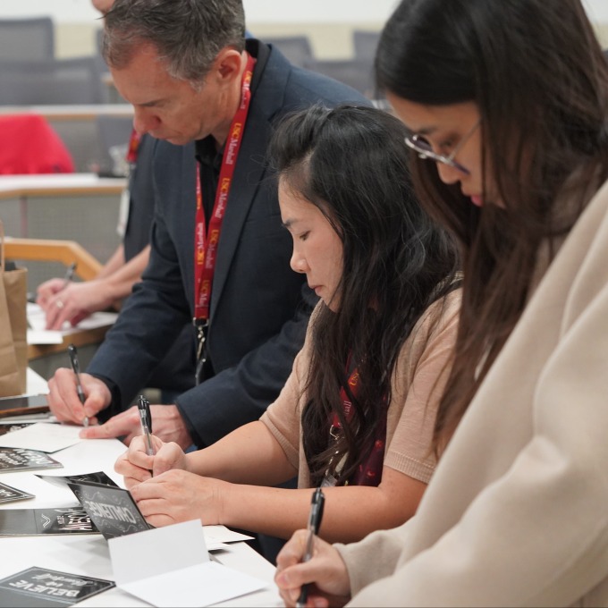 Volunteers writing notes
