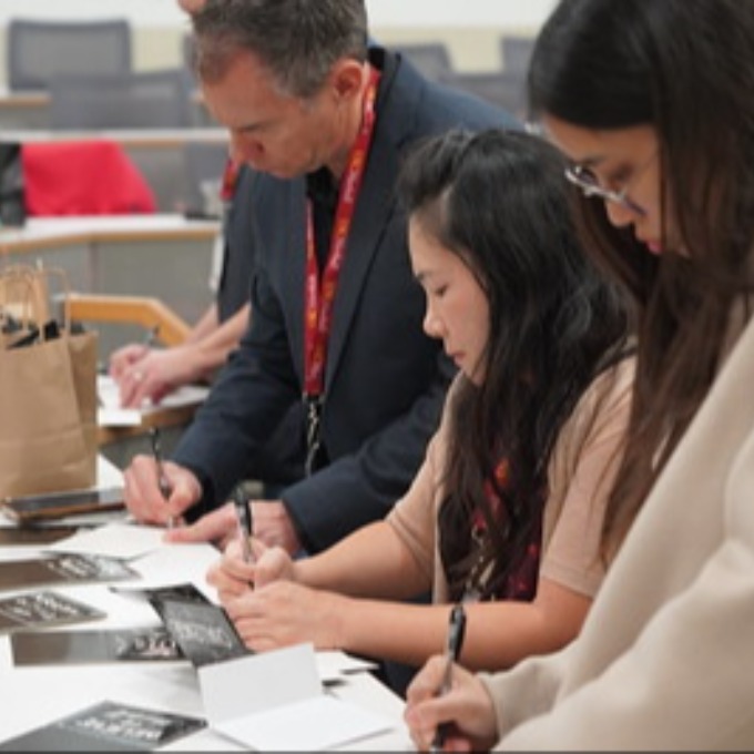 Volunteers writing notes