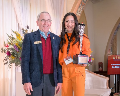 Lloyd Greif and Amy Liu pose with the Alumni Entrepreneur of the Year award