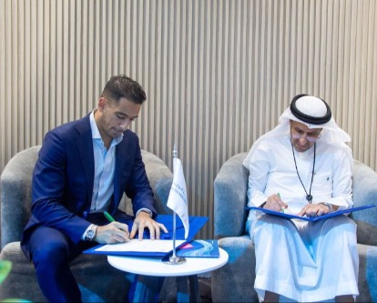Omar signing MOU with CEO of Health Holding Company in Riyadh, Saudi Arabia
