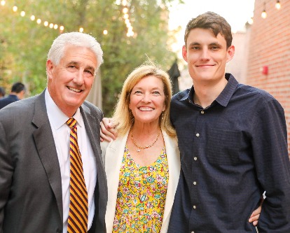Color photo of John P. Barrett standing with his wife